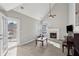 Bright living room featuring a fireplace, high ceilings, and French doors to a deck at 2058 Drogheda Ln, Marietta, GA 30066