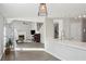 Open concept living space with a kitchen island, fireplace, and access to the outdoors at 2058 Drogheda Ln, Marietta, GA 30066