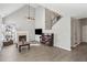 Spacious living room with hardwood floors, fireplace, vaulted ceiling, and a staircase leading upstairs at 2058 Drogheda Ln, Marietta, GA 30066