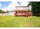 Spacious backyard featuring a charming two-story home and an expansive deck at 3730 Warriors Path, Decatur, GA 30034