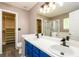 Bathroom features double sinks, tub, and separate access to walk in closet at 3730 Warriors Path, Decatur, GA 30034