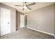 Bedroom features gray walls, a ceiling fan, and neutral carpet at 3730 Warriors Path, Decatur, GA 30034