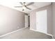 Bedroom features neutral walls, carpet, and a ceiling fan at 3730 Warriors Path, Decatur, GA 30034