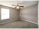 Small bedroom features neutral paint, carpet, and a ceiling fan at 3730 Warriors Path, Decatur, GA 30034