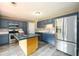 Modern kitchen featuring stainless steel appliances, an island, and ample counter space, perfect for cooking at 3730 Warriors Path, Decatur, GA 30034