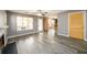 Bright living room with hardwood floors, access to the yard, and white fireplace at 3730 Warriors Path, Decatur, GA 30034