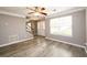 Spacious living room with neutral walls, white trim, updated floors, and staircase to the upper level at 3730 Warriors Path, Decatur, GA 30034