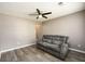 Cozy living room with new floors, neutral paint, and a comfortable gray sofa perfect for relaxing at 3730 Warriors Path, Decatur, GA 30034
