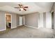 Spacious main bedroom features a tray ceiling, ceiling fan, and access to bathroom at 3730 Warriors Path, Decatur, GA 30034