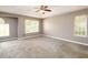Bright main bedroom features neutral paint, carpet, and a ceiling fan at 3730 Warriors Path, Decatur, GA 30034