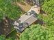 Aerial view showcasing the property nestled among lush trees, highlighting its serene and private location at 5155 Oakdale Ct, Douglasville, GA 30135