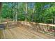 Wood deck with rail overlooks wooded backyard area at 5155 Oakdale Ct, Douglasville, GA 30135