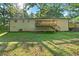 Spacious backyard featuring a charming wooden deck and lush green grass, perfect for outdoor activities at 5155 Oakdale Ct, Douglasville, GA 30135
