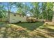 The backyard showcasing a wooden deck, offering a great space for outdoor gatherings and relaxation at 5155 Oakdale Ct, Douglasville, GA 30135