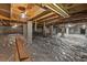 Spacious unfinished basement area with concrete foundation and plastic sheeting, offering potential for customization at 5155 Oakdale Ct, Douglasville, GA 30135