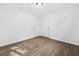 Bright bedroom with wood-look flooring, freshly painted white walls, and closet providing a tranquil space at 5155 Oakdale Ct, Douglasville, GA 30135
