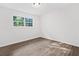 Bright bedroom features modern flooring, neutral paint, and ample natural light at 5155 Oakdale Ct, Douglasville, GA 30135