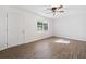 Bedroom featuring ceiling fan, window and new flooring at 5155 Oakdale Ct, Douglasville, GA 30135