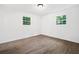 Bright bedroom with new flooring and a view of the outdoors from the windows at 5155 Oakdale Ct, Douglasville, GA 30135