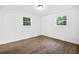 Neutral bedroom with wood-look floors and lots of natural light at 5155 Oakdale Ct, Douglasville, GA 30135