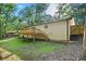 Back exterior view of house and deck overlooking the yard at 5155 Oakdale Ct, Douglasville, GA 30135