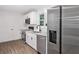 Bright kitchen with stainless appliances, white cabinets and new flooring at 5155 Oakdale Ct, Douglasville, GA 30135