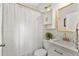 Stylish bathroom featuring a shower with a curtain, a vanity with storage, and modern fixtures at 571 Morgan Ne St, Atlanta, GA 30308