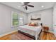 Charming bedroom featuring hardwood floors, area rug, and a ceiling fan at 571 Morgan Ne St, Atlanta, GA 30308