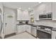 Updated kitchen featuring white cabinets, stainless steel appliances, and modern backsplash at 571 Morgan Ne St, Atlanta, GA 30308