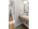 Charming bathroom with a rustic wood countertop and modern fixtures at 7255 Old Rico Rd, Chattahoochee Hills, GA 30268