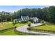 Stunning home on a large lot with circular driveway and expansive front lawn at 7255 Old Rico Rd, Chattahoochee Hills, GA 30268