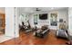 Well-equipped home gym with modern exercise equipment and hardwood flooring at 7255 Old Rico Rd, Chattahoochee Hills, GA 30268