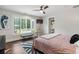 Bright main bedroom features large windows overlooking the backyard at 7255 Old Rico Rd, Chattahoochee Hills, GA 30268