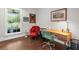 Bright office space featuring hardwood floors, stylish furniture, and a large window with a view at 7255 Old Rico Rd, Chattahoochee Hills, GA 30268