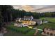 Aerial view of a luxury estate boasting a swimming pool, lush lawn, and a dark wood fence at 7255 Old Rico Rd, Chattahoochee Hills, GA 30268