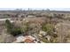 High definition aerial view of wooded Atlanta neighborhood with city skyline in the distance at 1466 University Dr, Atlanta, GA 30306