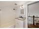 Bathroom with white tiled walls, granite countertop, and walk-in shower at 1466 University Dr, Atlanta, GA 30306