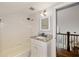 Bathroom with shower and tub combo, featuring a granite vanity and modern lighting at 1466 University Dr, Atlanta, GA 30306