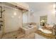 Luxurious bathroom featuring a walk-in shower, soaking tub, and elegant fixtures, perfect for relaxation and pampering at 1466 University Dr, Atlanta, GA 30306