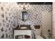 Full bathroom with unique wallpaper, modern fixtures, and a combined tub and shower at 1466 University Dr, Atlanta, GA 30306