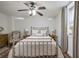 A cozy bedroom with a metal frame bed, neutral colors, and natural light from the window at 1466 University Dr, Atlanta, GA 30306