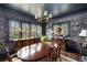 Elegant dining room boasting a wood table, decorative wallpaper, and natural light at 1466 University Dr, Atlanta, GA 30306