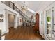 Grand foyer with soaring ceilings, elegant staircase, hardwood floors, and abundant natural light at 1466 University Dr, Atlanta, GA 30306