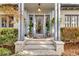 Inviting front entrance featuring brick steps, potted topiaries, and a glass-paneled door at 1466 University Dr, Atlanta, GA 30306