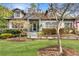Charming two-story home with landscaped yard and inviting front porch and dormer windows at 1466 University Dr, Atlanta, GA 30306