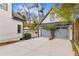 View of the two-car garage with matching paint and large driveway of the house at 1466 University Dr, Atlanta, GA 30306