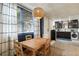 Basement kitchen with dining nook featuring natural light and laundry appliances at 1466 University Dr, Atlanta, GA 30306