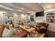 Spacious living room featuring coffered ceilings, custom built-ins, and comfortable seating arrangement at 1466 University Dr, Atlanta, GA 30306