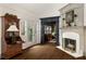 Inviting living room with fireplace, hardwood floors, and an open archway to additional living space at 1466 University Dr, Atlanta, GA 30306
