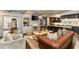 Spacious living room seamlessly connects to a modern kitchen with dark cabinetry and island seating at 1466 University Dr, Atlanta, GA 30306